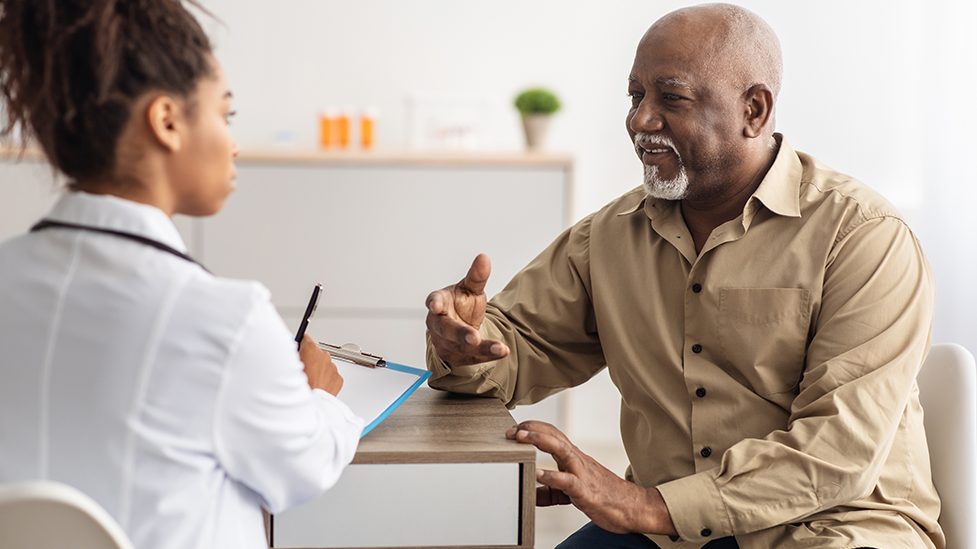 A man talking to a naturopathic doctor about how to treat gallstones naturally at Health for Life Naturopathic Medicine in Phoenix, AZ