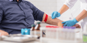 A man getting his blood drawn by a phlebotomist at Health for Life Naturopathic Medicine in Phoenix, AZ.