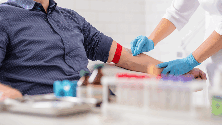 A man getting his blood drawn by a phlebotomist at Health for Life Naturopathic Medicine in Phoenix, AZ.