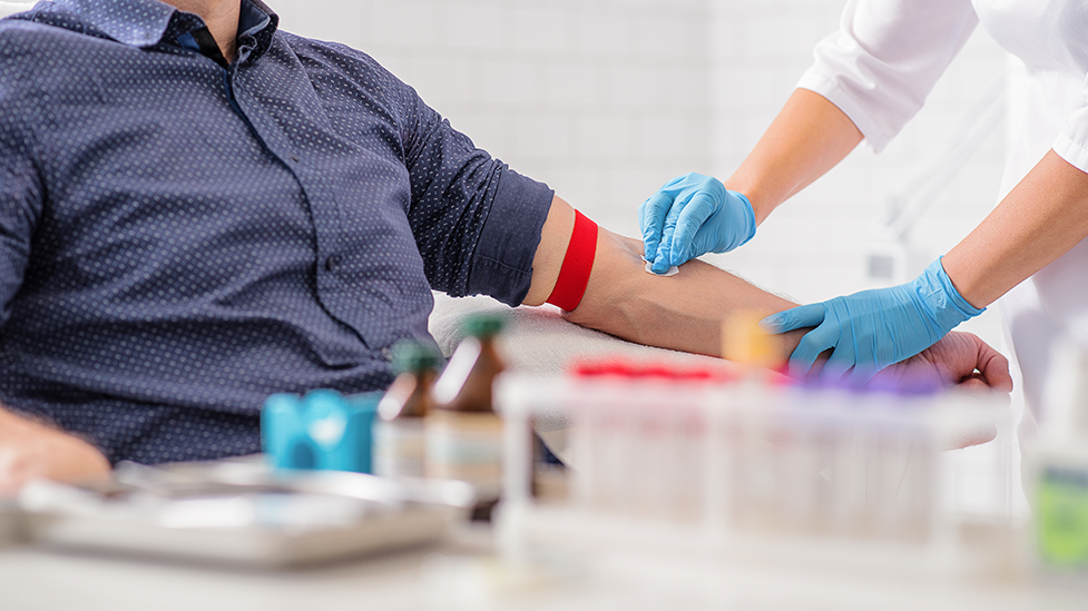 A man getting his blood drawn by a phlebotomist at Health for Life Naturopathic Medicine in Phoenix, AZ.