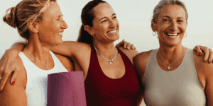 A group of middle-aged women in athletic clothing enjoying each other's company and being active together.