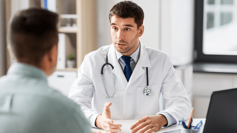 Naturopathic doctor discussing TB-500 peptide therapy and recovery support with a patient in Scottsdale, Arizona.
