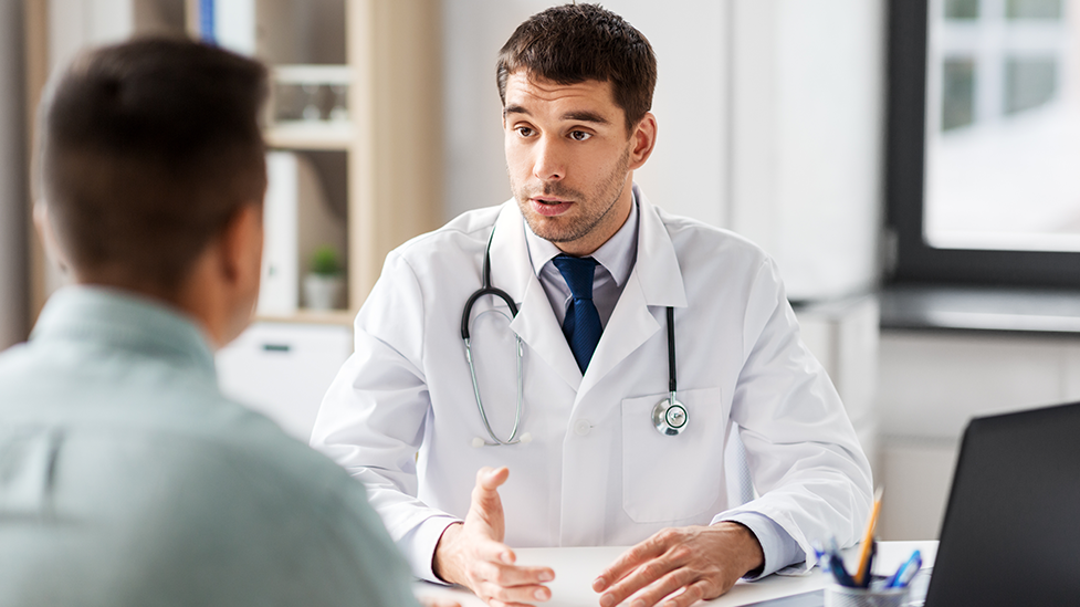 Naturopathic doctor discussing TB-500 peptide therapy and recovery support with a patient in Scottsdale, Arizona.