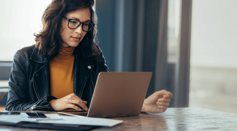 Woman relaxing at home with a warm drink, representing calm focus and relief from brain fog