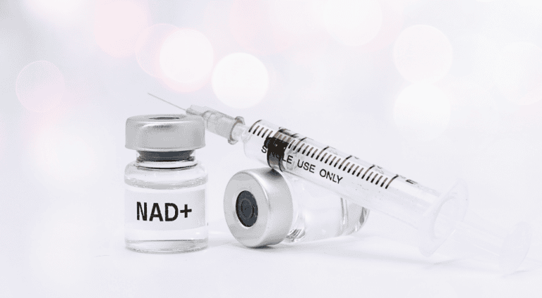 Vial labeled NAD+ with a syringe, representing NAD injection and IV therapy offered in Scottsdale, AZ