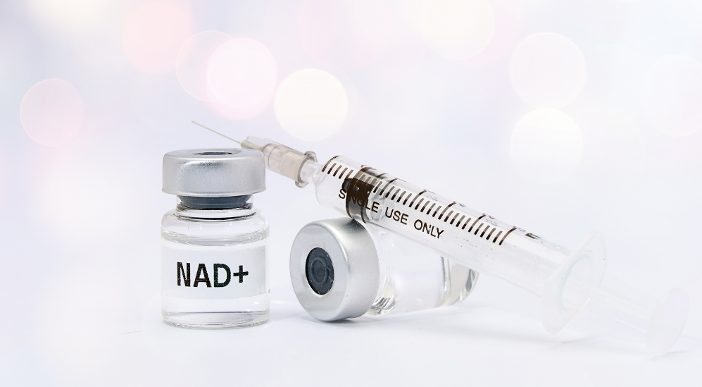 Vial labeled NAD+ with a syringe, representing NAD injection and IV therapy offered in Scottsdale, AZ