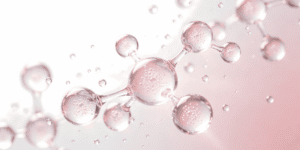 Close-up of molecular chain droplets, representing tesamorelin peptide therapy offered in Scottsdale, AZ