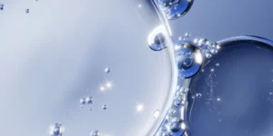 Abstract molecular bubbles representing GLOW peptide therapy and cellular health